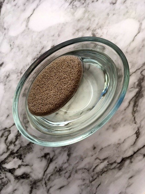 soaking a pumice stone in water and bleach.